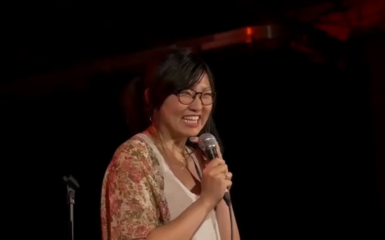 A producer speaking during a multidisciplinary cultural festival